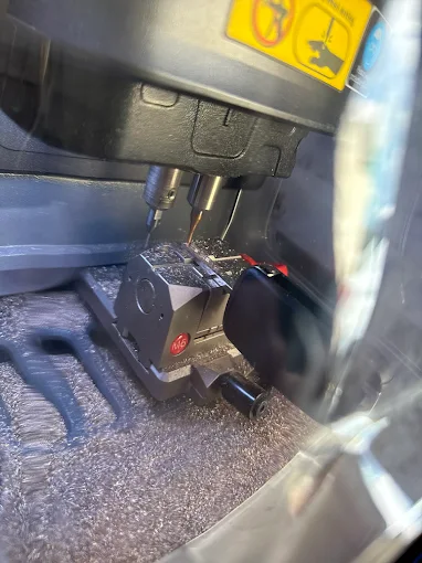 Locksmith cutting replacement car key on-site in Pittsburgh